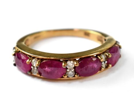 A 9ct gold diamond and ruby half eternity ring, four oval cut rubies separated with five columns bearing two tiny diamonds, s