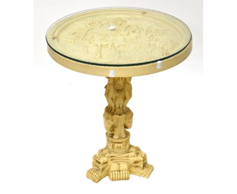 A resin circular side table, the top moulded with an Oriental coaching scene, on a column of deities and elephants, on tripod