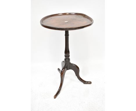 A George III oak occasional table with a lipped top, on a baluster turned column with tripod base, height 70cm, diameter 44cm