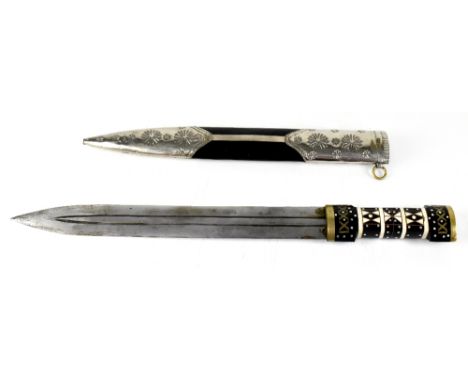 An early 19th century Middle Eastern khanjali fighting knife with ebony, ivory, copper, brass and silver dot inlay adorning t