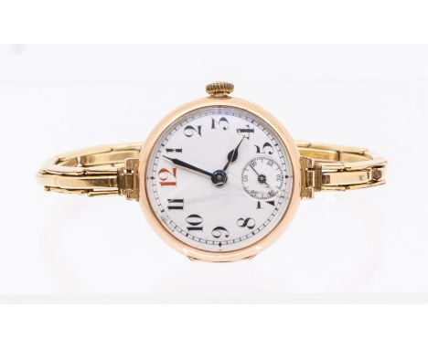 Rolex- a ladies early 20th Century 9ct gold cased Rolex wristwatch, white enamel dial with painted number markers, red 12 o'c