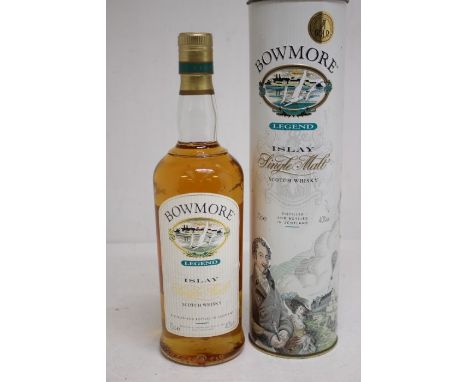 A Bottle Of Bowmore Legend Single Malt Scotch Whisky In Presentation Tin Tin Has Signs Of Rusting, But Bottle Is In Good Over