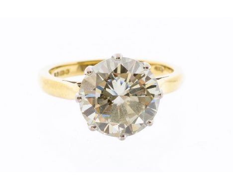 A diamond solitaire 18ct gold ring, comprising a round brilliant cut diamond weighing approx 3.9 carats, assessed clarity VVS