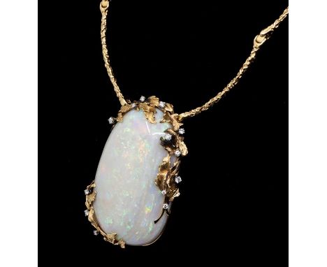 **REOFFER DECEMBER 7TH FINE ART £5000-8000** A large opal and diamond gold pendant, comprising an pebble shaped opal approx 4
