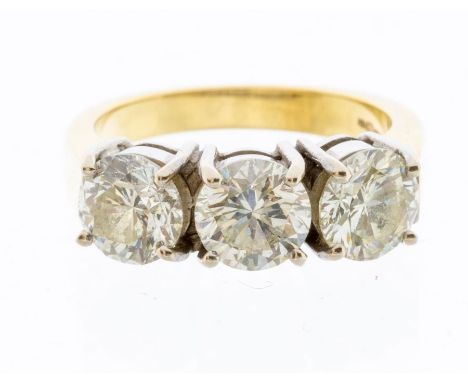 A three stone diamond and 18ct gold ring, comprising three round brilliant cut diamonds weighing a total approx 3 carats, ass