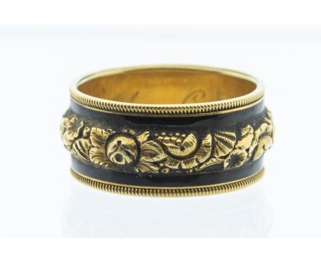 A George III gold and enamel mourning ring, with high relief floral decoration to the centre with black enamel edges, inscrib