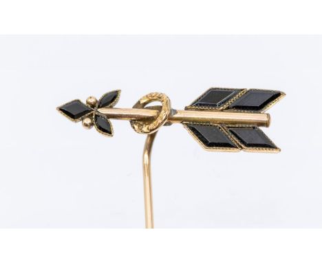 A Victorian onyx and rose gold stick pin, comprising an onyx set arrow top, collet set with milled borders, central gold hoop