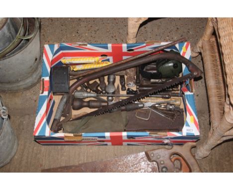A box of various hand tools