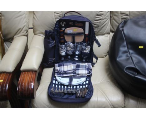 A picnic hamper with contents 