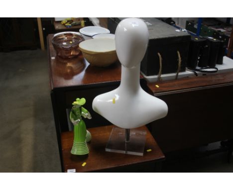 A mannequin; together with a glass figurine