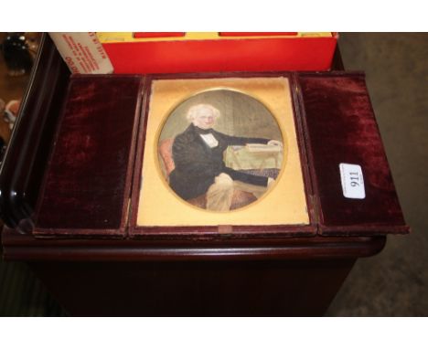 A 19th century portrait miniature of a seated gentleman 