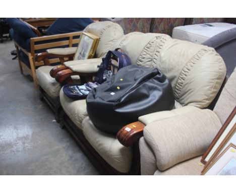 A wooden framed two seater settee with matching armchair 