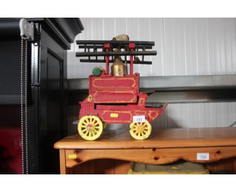 A wooden model of a horsedrawn fire engine