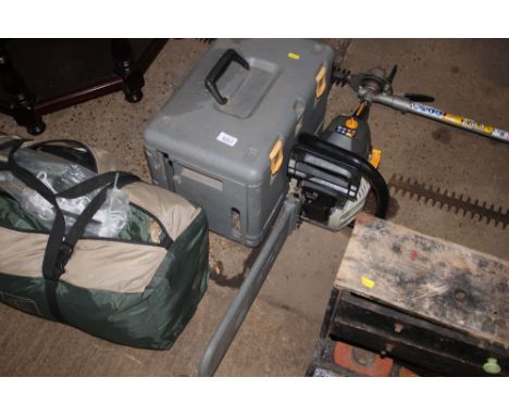 A Ryobi petrol chainsaw with fitted case