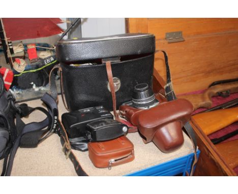 A quantity of cameras; and a camera bag and contents 