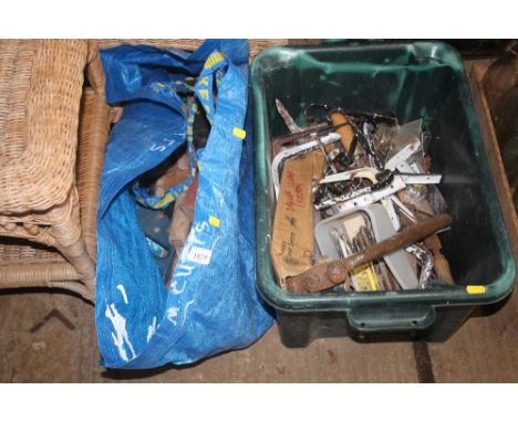 A bag and a plastic crate of various fittings and tools
