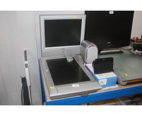 A Hitachi speaker together with Philips flat screen television and a monitor 