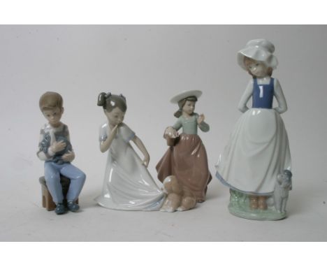 A Collection of four Nao porcelain figures of young children 
