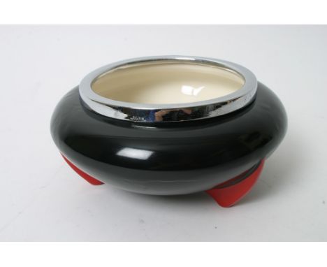 An Art Deco Wilkinson 'Yoo Hoo' pattern bowl having black body on red tripod feet with chrome rim. Design attributed to Clari