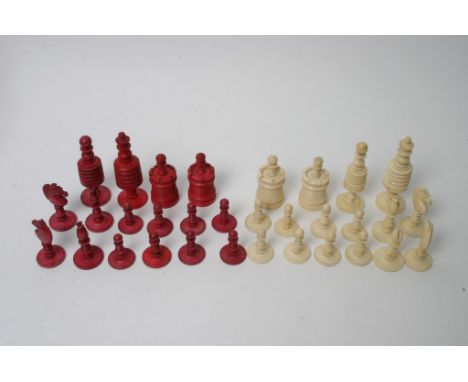 A late 19th century turned and coloured bone chess set 