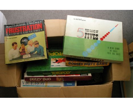 A box containing a collection of boxed games including chess, cluedo, Roulette, Dizzy bug, Donkey Party Game, Totpoly, game o