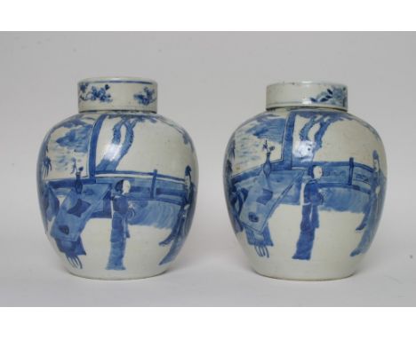 A pair of Chinese blue and white ginger jars decorated with figures in a garden setting and bearing four character Kangxi mar