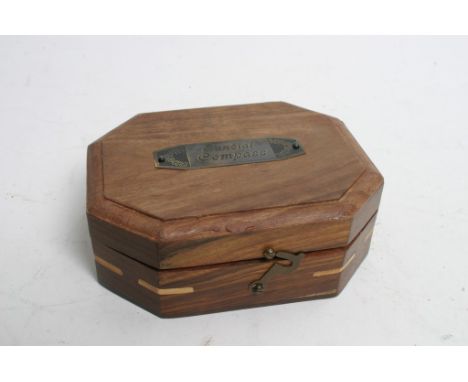 A reproduction Sundial Compass in hardwood box