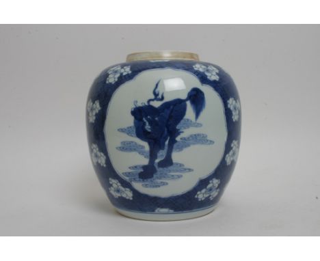 A Kangxi blue and white ginger jar decorated with panels of foliage and a Qilin on a cracked ice ground with Prunus blossom. 