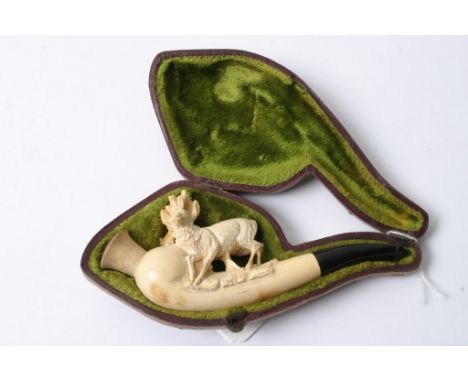 A cased meerschaum pipe carved with a raised stag