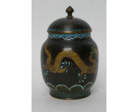 A Chinese cloisonne jar and cover decorated with dragons in a yellow enamel on a black ground. Height: 19cm approximately