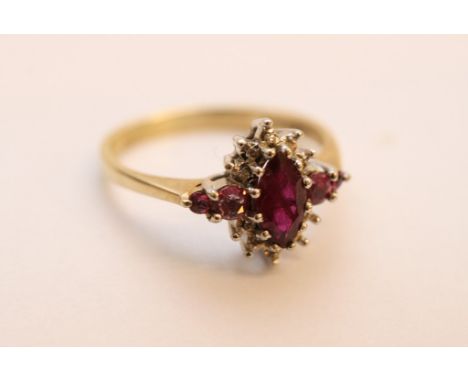 A ladies 9ct yellow gold ruby and diamond cluster ring