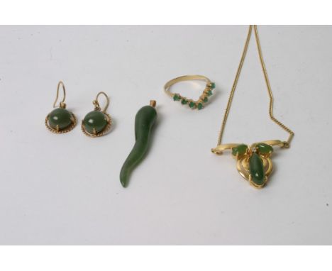 A collection of gold jewellery comprising a green jade set pendant on chain, a pair of conforming earrings, an emerald set wi