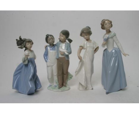 A collection of four Nao porcelain figures of children 
