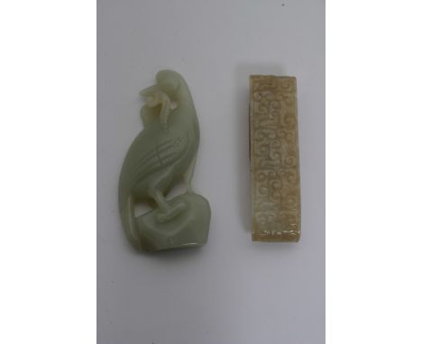 Two Chinese jade carvings, one in the form of a bird holding lingzhi, the other an archaic style belt hook