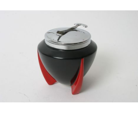 An Art Deco Wilkinson 'Yoo Hoo' pattern sugar bowl having black body on red tripod feet with chrome lid fitted with tongs Des