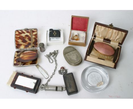 An interesting collection of oddments including an enamel backed brush, police whistle, cigarette cases and other items