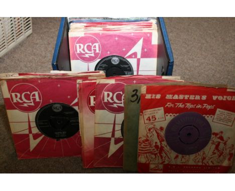 A blue record box containing a quantity of Elvis Presley 45 records