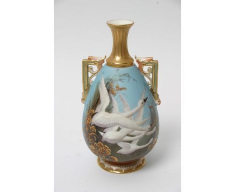 A fine Royal Worcester vase decorated with flying swans on a blue ground, signed C Baldwin (16cm) 