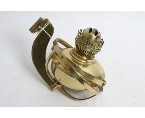A brass gimble oil lamp