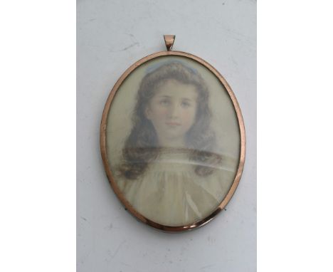 A framed oval portrait miniature depicting a young girl, possibly Enid Linder who contributed to the art of Beatrix Potter, s