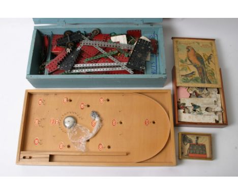 A box of Meccano, a Bagatelle game, an old jigsaw and 'The Radio' puzzle