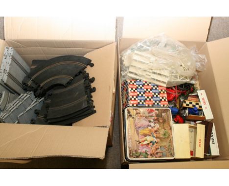 Two boxes containing a collection of scalextric cars and accessories including a boxed entrance building No 233
