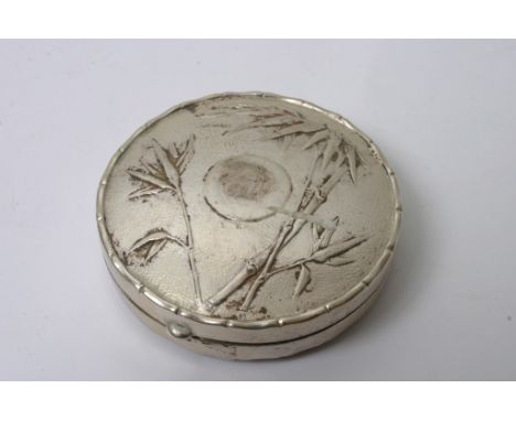 A Chinese silver powder compact by Hung Chong & Co. with raised bamboo to the lid