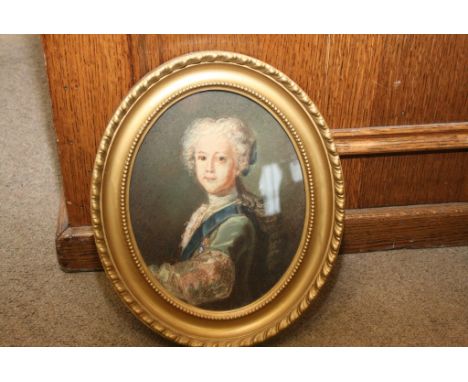 An oval framed pastel portrait of a young man, the reverse with gallery label Chas Chenil & co Kings Road, Chelsea 