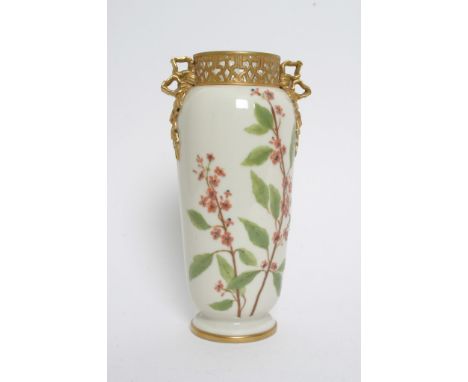 A quality porcelain vase tube lined decoration with raised foliage and flowers marks to the base possible Worcester height 24