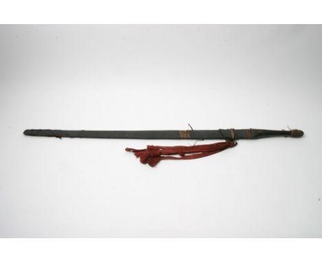 A 19th century North African or Middle Eastern sword having leather scabbard