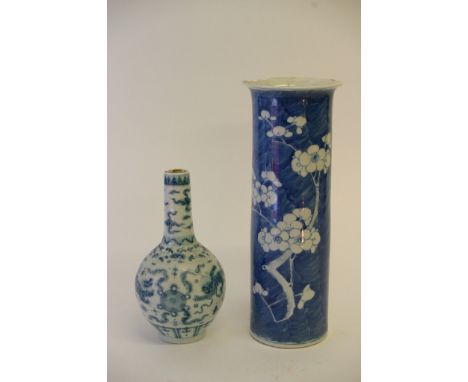A 19th century Chinese blue and white cylinder vase with Kangxi mark, together with a smaller blue and white bottle vase. Hei