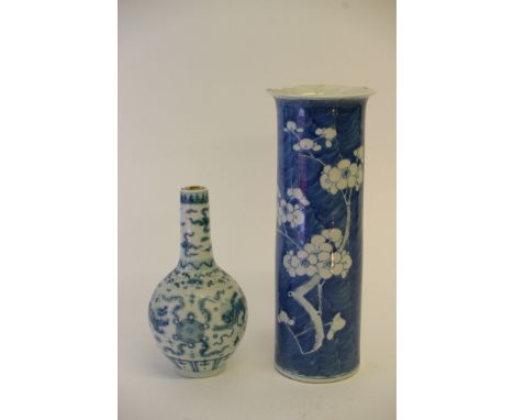 A 19th century Chinese blue and white cylinder vase with Kangxi mark, together with a smaller blue and white bottle vase. Hei