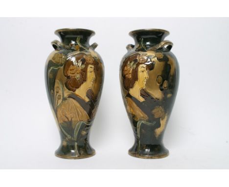 A pair of Art Nouveau ceramic vase decorated with female figures and foliage 