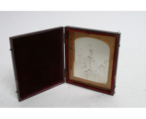 An early unknown portrait silver photograph on glass, hand coloured, depicting a seated young lady in a fitted leather case